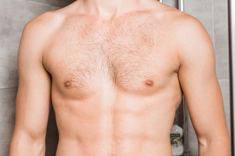 topless male in shower room