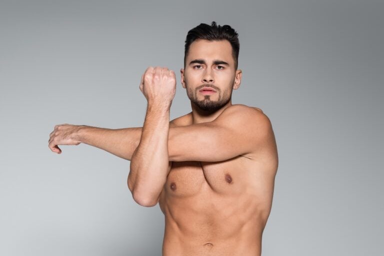 man stretching arms