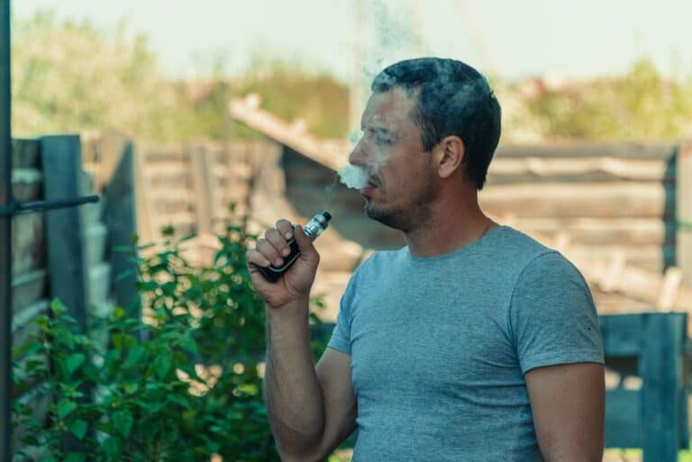 man vaping outside